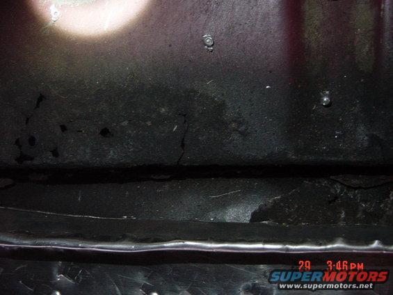 close-up of dark metal surface with rust and damage, timestamp 29 3:46 PM, Supermotors.net logo