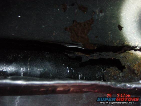 1988 Ford F-150 frame with significant rust and damage