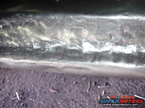 Close-up of a metal surface showing weld marks and texture