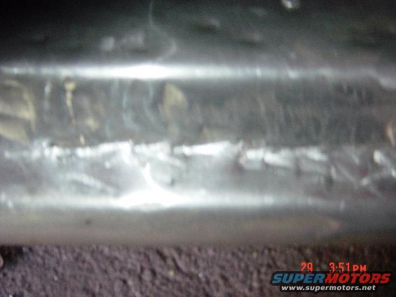 Close-up of textured chrome trim, possibly from a vehicle