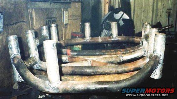 fuelcage6.jpg A slight curve and 1 less spacer to clear the exhaust on one side