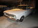 1964 Ford Ranchero - White 1964 Ford Ranchero parked in a garage at night.