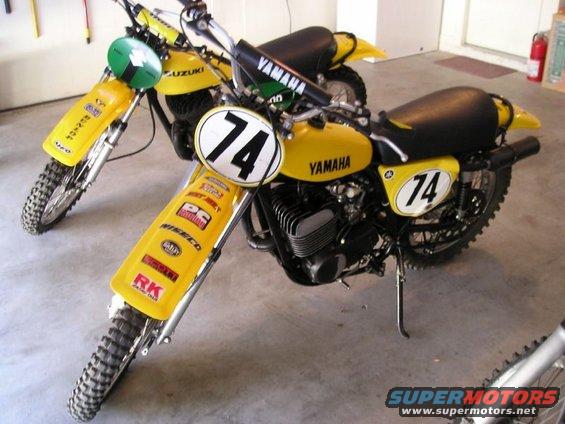 Two yellow Yamaha motorcycles with number 74 plates and racing decals