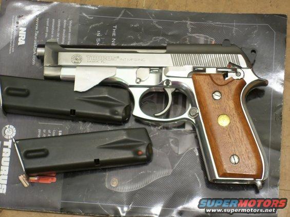 Taurus PT92 AF pistol with wood grips and two magazines