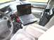 1997 Mercury Grand Marquis - Laptop mounted on a stand in the passenger seat of a 1997 Mercury Grand Marquis.