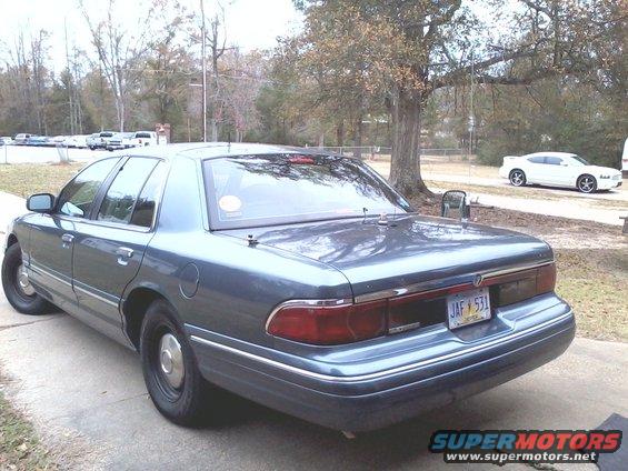 Blue 1997 Mercury Grand Marquis, rear 3/4 view
