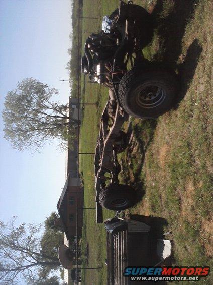 Truck chassis and engine on grass