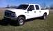 2002 Ford F-250 - White 2002 Ford F-250 Super Duty pickup truck with a crew cab and long bed.