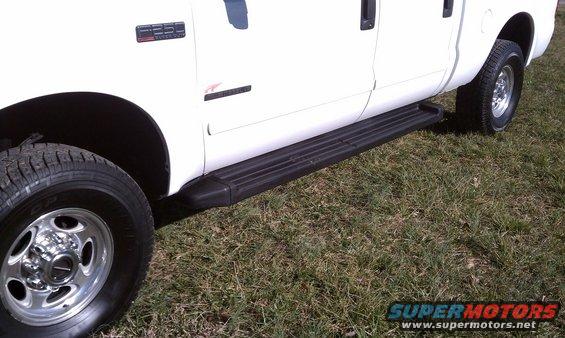 White 2002 Ford F-250 side view with running boards and F-250 badge