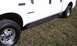2002 Ford F-250 - Side view of a white 2002 Ford F-250 truck, clearly showing the F-250 badging and side running boards.