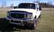 2002 Ford F-250 - Front 3/4 view of a white 2002 Ford F-250 truck with a chrome bull bar.