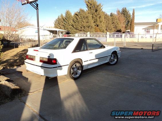White 1989 Ford Mustang GT coupe from rear-side angle