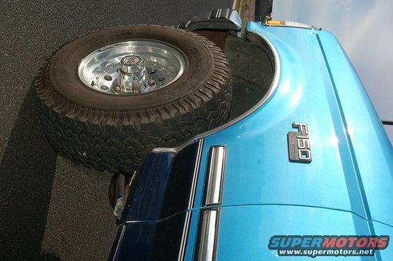 Blue 1992 Ford F-150 fender with F150 badge and spare tire mounted