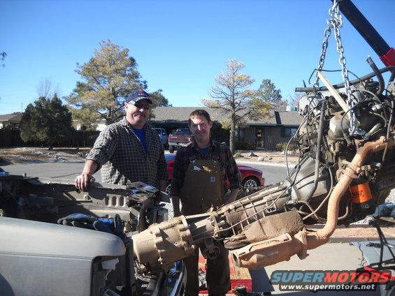 Engine and transmission assembly being hoisted out of a vehicle