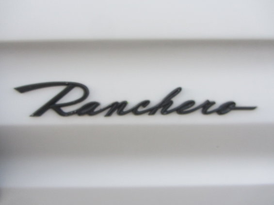 Black script 'Ranchero' badge on a white background
