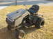 2010 Kawasaki BAYOU 220 - This Craftsman riding mower appears to be in a state of disrepair, with a worn seat and mud-splattered body.