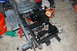 2010 Kawasaki BAYOU 220 - The rear axle assembly of a lawn tractor is shown in a garage setting, with various tools and parts visible.