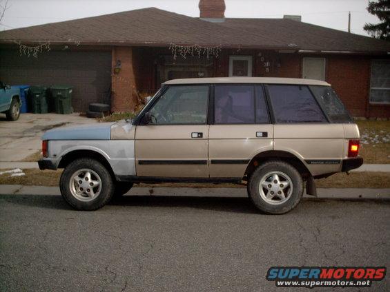 Side view of a 1991 Land Rover Range Rover with tan and light blue body panels