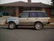 1991 Land Rover Range Rover - This 1991 Land Rover Range Rover is seen from the side, a two-tone paint scheme with tan and light blue sections.