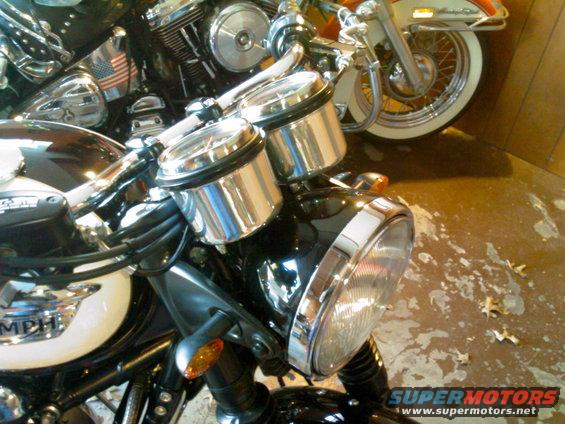added brushed aluminum gauge cups, lay flat instrument panel and powder coated headlight bucket. short stem cat eye signals as well.