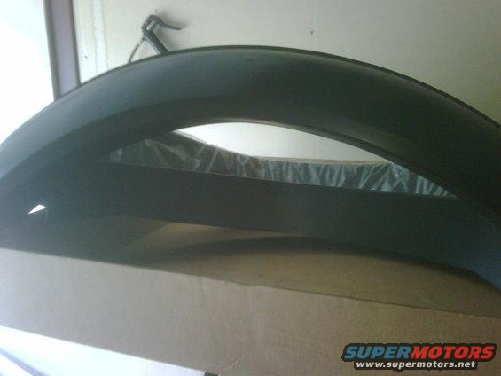 black fender flare over cardboard box