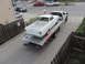 1964 Ford Ranchero - White 1964 Ford Ranchero on a tow truck, viewed from the rear.