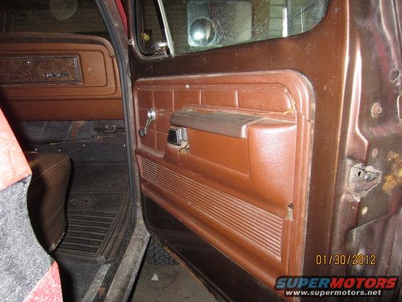 1979 Ford Bronco interior door panel with brown vinyl and chrome crank