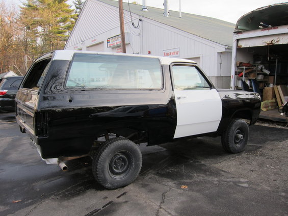 Black and white two-tone SUV, side view. 1987 Dodge 1500