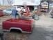 1987 Ford Ranger - A disassembled 1987 Ford Ranger pickup truck sits in a yard, with its bed separated from the chassis.