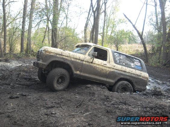 1978 Ford Bronco stuck in thick mud off-road