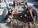 1987 Ford Ranger - A heavily rusted truck frame sits on the ground, stripped of its body and engine.