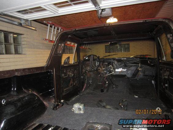 Interior of a disassembled SUV, showing dashboard and empty cabin