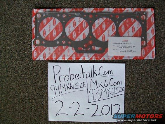 Engine gasket set in packaging with handwritten notes and date