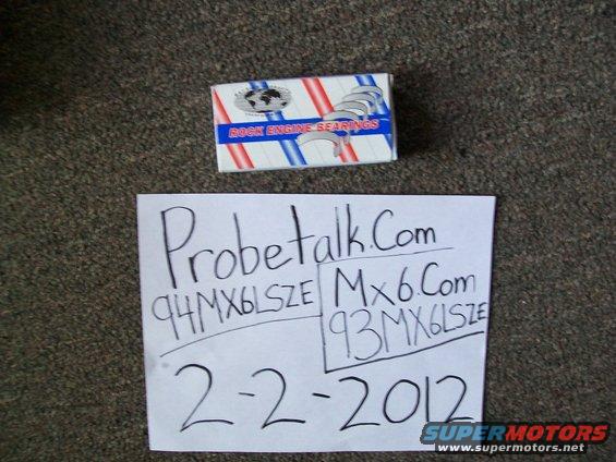 Box of engine bearings and paper with 'Probetalk.Com 94MX6LSZE Mx6.Com 93MX6LSZE 2-2-2012' written on it