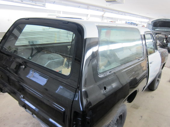 1987 Dodge Ramcharger in black and white primer, rear quarter view