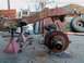 1987 Ford Ranger - This heavily rusted vehicle frame and suspension components are supported by jack stands outdoors.
