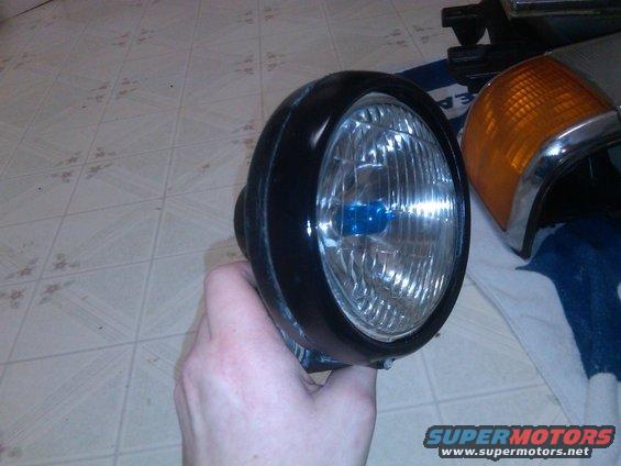 img00035201202041950.jpg (fixin up the headlights)
-new tusk super white bulbs
-repainted the light trim rings

one done