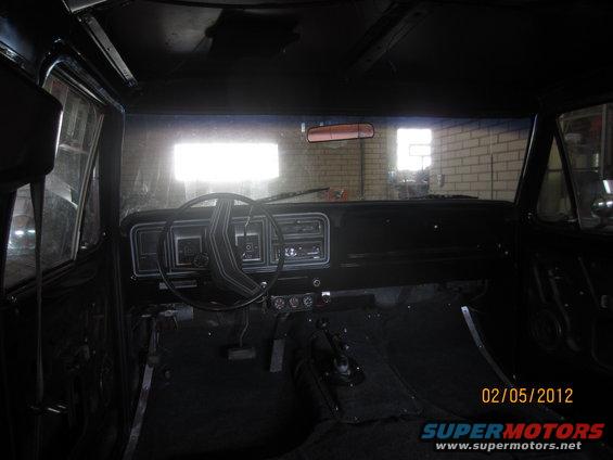 Interior of a 1979 Ford Bronco, showing dashboard and steering wheel