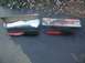 1992 Mercury Grand Marquis - Two Edelbrock shock absorbers are displayed on a dark surface next to their packaging.