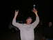 1988 Ford Bronco - A man celebrates with a trophy in front of a white 1988 Ford Bronco at night.