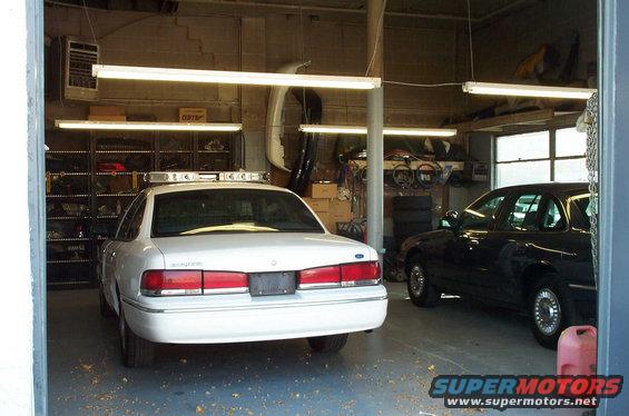 95-stipped-garage.jpg KC's garage with a '95 P71 being reconditioned. The car next to it is a nice Medium Wedgewood Blue '95 P71. (large pic)