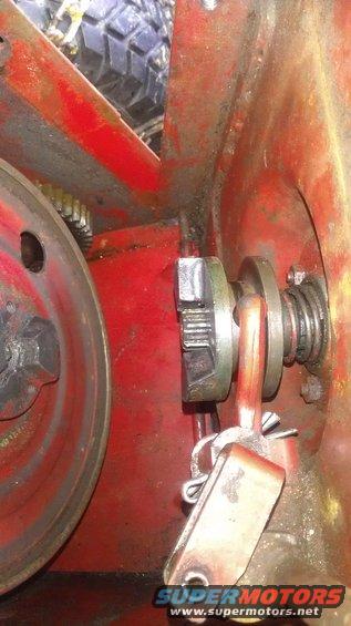 Close-up of pulley and gears on red machinery