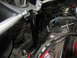 1964 Ford Ranchero - Close-up view of the engine bay bracing on a 1964 Ford Ranchero, showing adjustable rods and a black support structure.