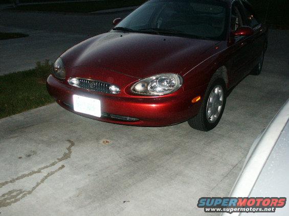 1998 Mercury Sable front corner parked on concrete driveway