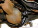 1995 Ford Bronco - Underside view of a vehicle's rear differential housing, showing rust and oil.