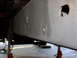 1995 Ford Bronco - The underside of a vehicle's frame rail is shown, supported by jack stands.