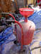 1995 Ford Bronco - This sandblaster has a funnel attachment and is covered in dust.