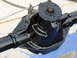 1995 Ford Bronco - A black rear axle differential housing is shown, with a part number stamped on its casing.