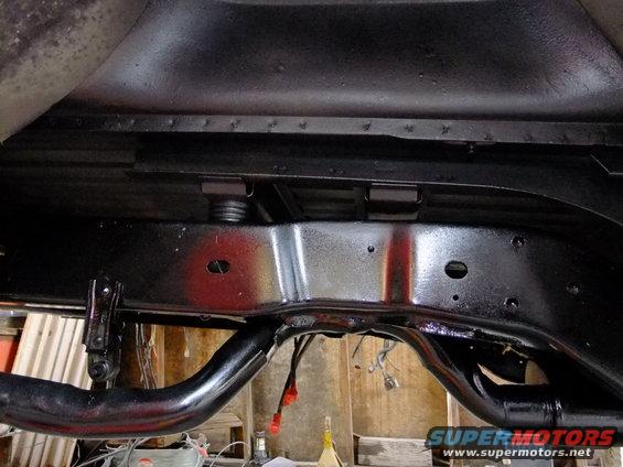 1995 Ford Bronco rear frame and suspension after detailing, showing painted chassis components and exhaust pipe