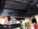 1995 Ford Bronco - Underside view of a vehicle's chassis, showing frame rails and exhaust components.